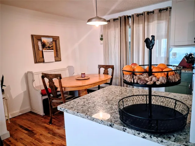 a living room with furniture a rug and a chandelier