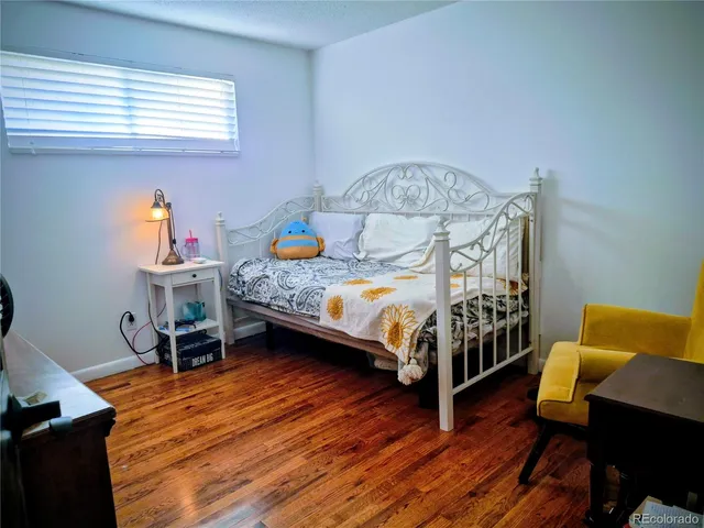 a bedroom with bed and a window