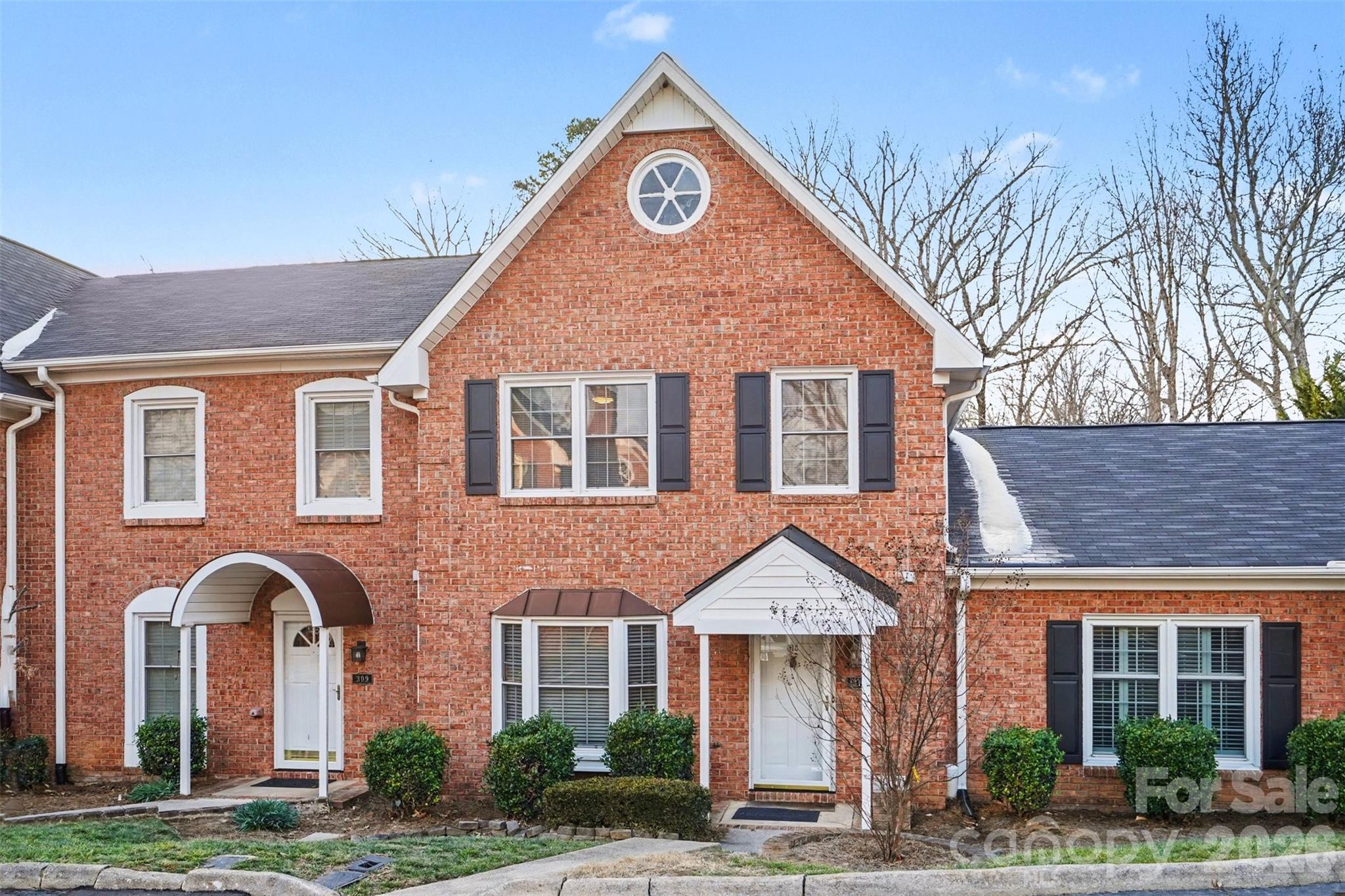 313 Wisteria Lane Kannapolis, NC 28083 - Photo 2 of 23 a front view of a house with garden