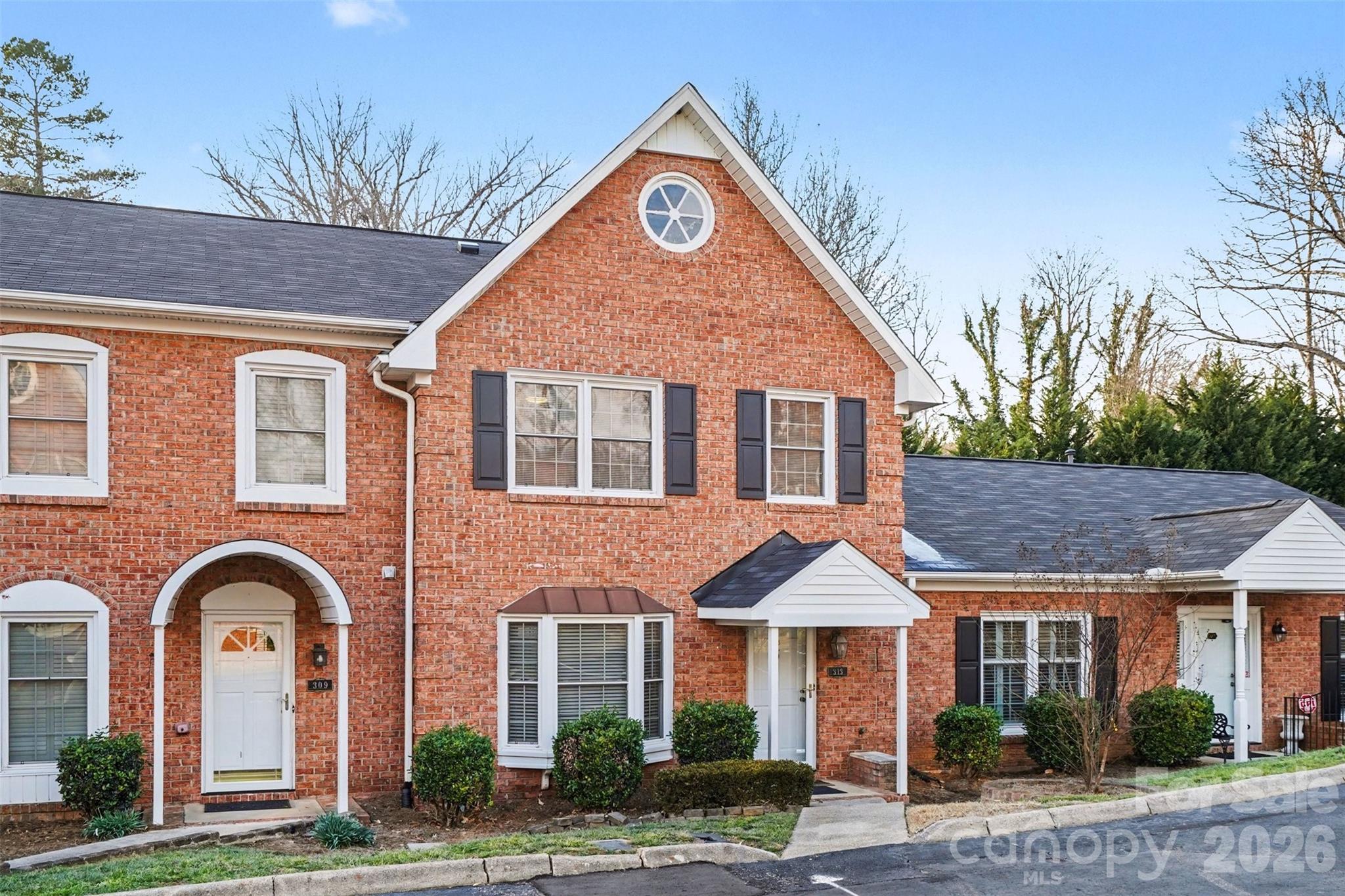 313 Wisteria Lane Kannapolis, NC 28083 - Photo 3 of 23 a front view of a house with garden
