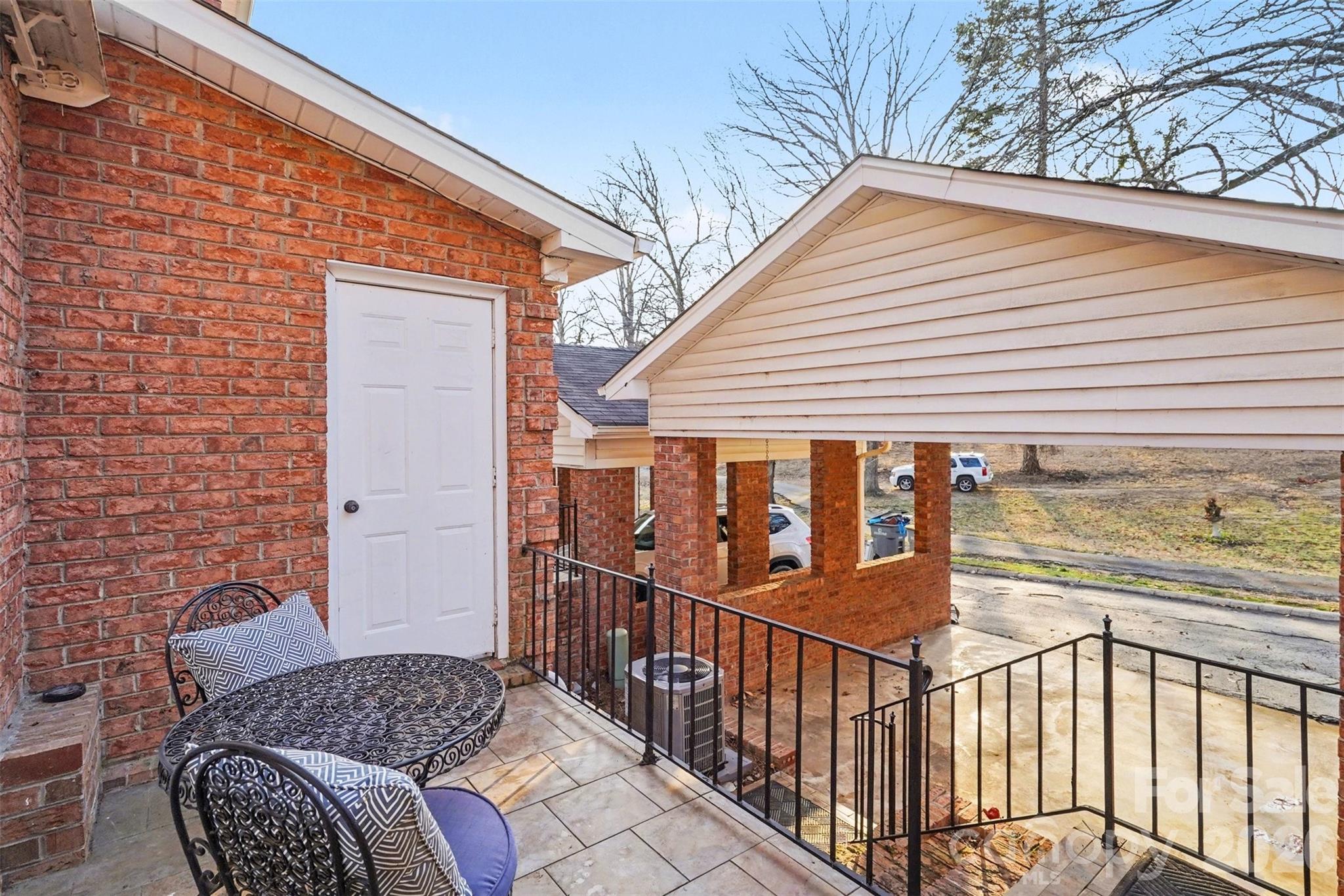313 Wisteria Lane Kannapolis, NC 28083 - Photo 4 of 23 a view of a house with wooden fence