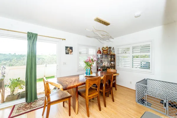 a dining room with furniture and window