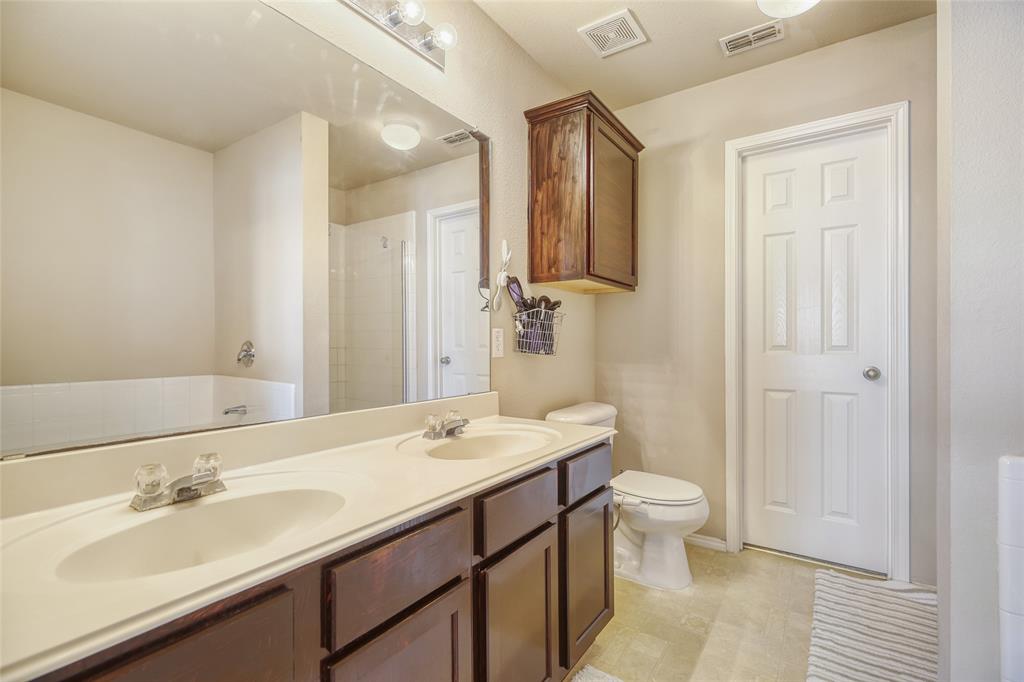 2002 Pin Oak Trail Anna, TX 75409 - Photo 20 of 29 a bathroom with a sink a toilet and a mirror