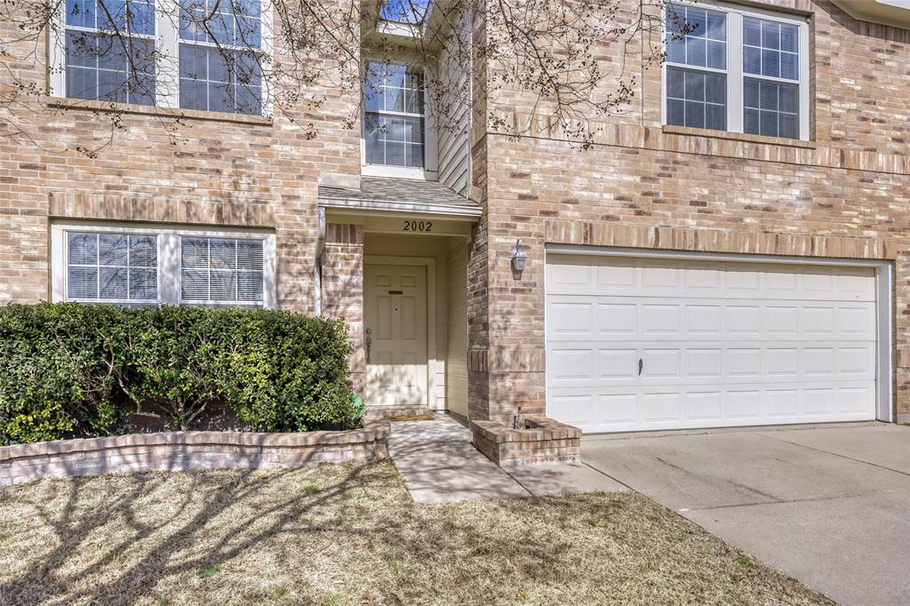 2002 Pin Oak Trail Anna, TX 75409 - Photo 3 of 29 a front view of a house with a yard