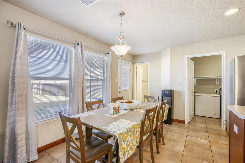 2002 Pin Oak Trail Anna, TX 75409 - Photo 8 of 29 a view of a dining room with furniture window and outside view