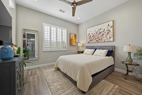 a bedroom with a bed and a window