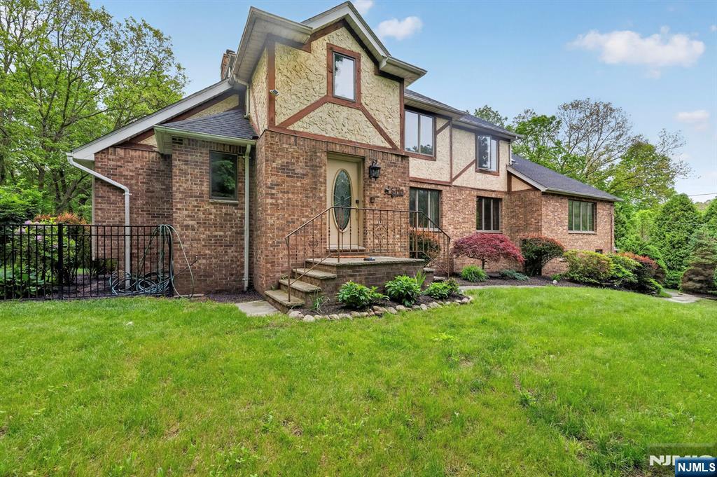 5110 Berkshire Valley Road Oak Ridge, NJ 07438 - Photo 48 of 49 a front view of a house with a garden