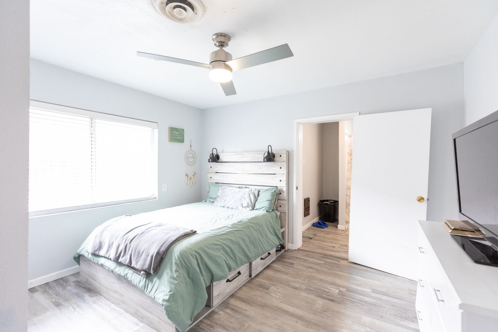 234 Panamint Avenue Ridgecrest, CA 93555 - Photo 14 of 25 a bedroom with a bed and a flat screen tv