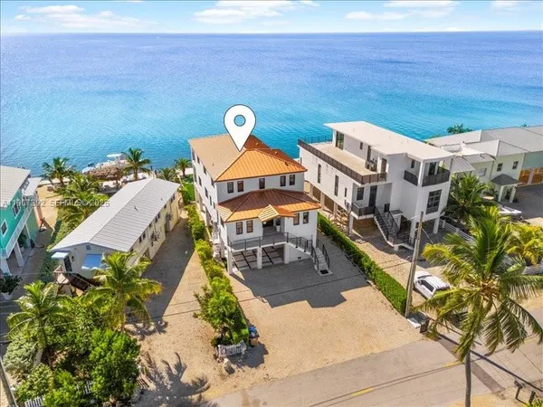 an aerial view of a house with outdoor space