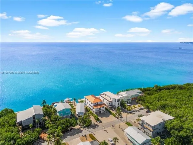 a living room with furniture gym equipment and a large window
