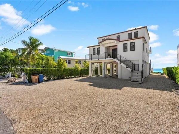 a view of a livingroom with furniture and a window