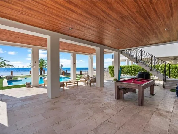 a large kitchen with a table and chairs