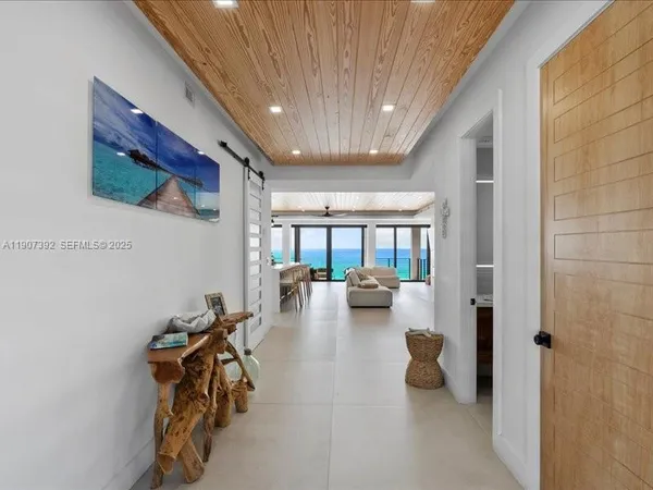 a large tub sitting in a room next to a window