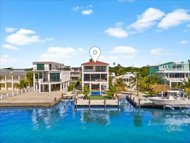 an aerial view of a house with a garden