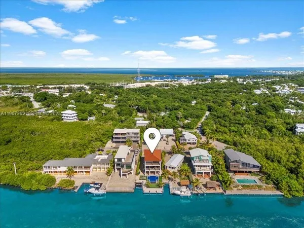 an aerial view of a houses with outdoor space