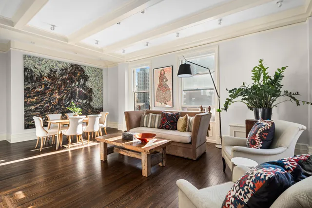 a bathroom with a bathtub sink and double vanity
