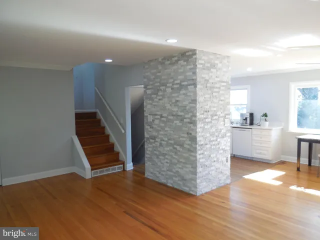 a view of kitchen and wooden floor