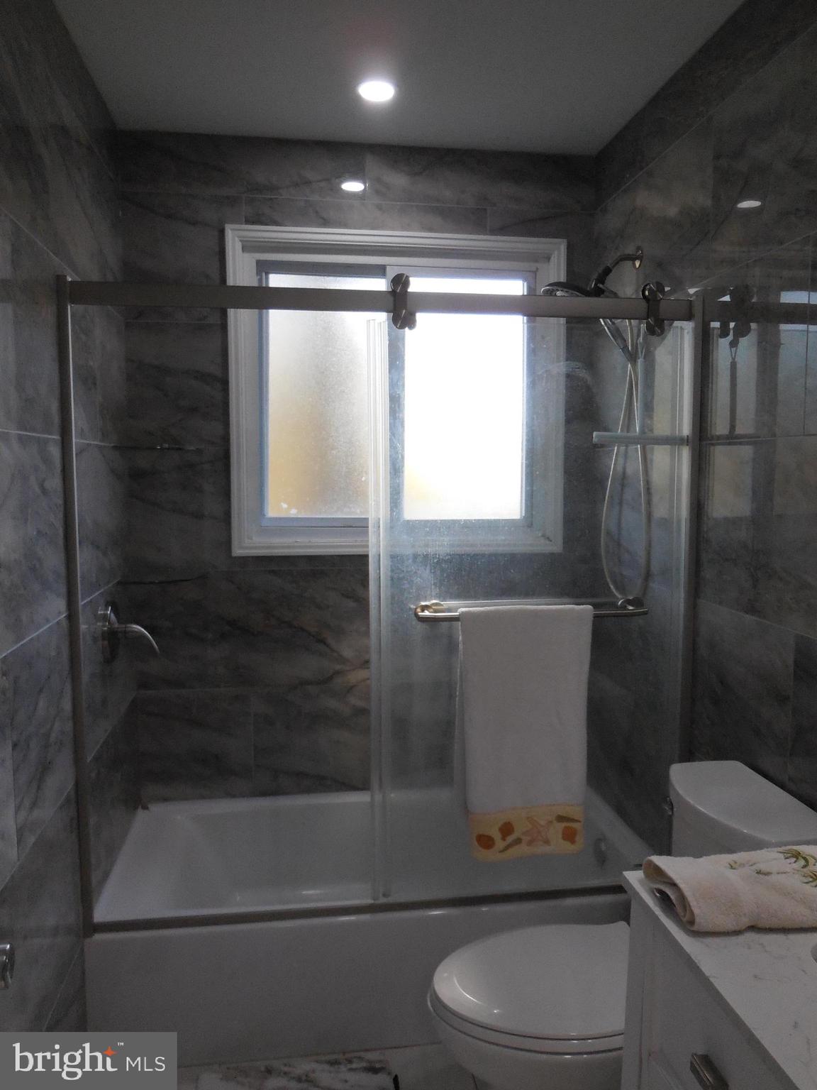 607 Church Road Reisterstown, MD 21136 - Photo 23 of 34 a bathroom with a shower a toilet and sink