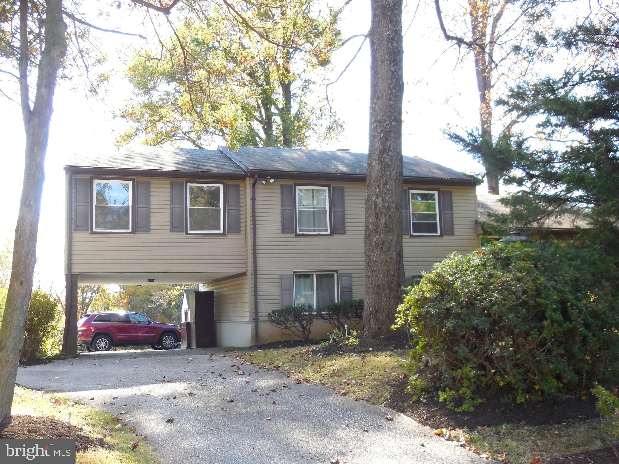 607 Church Road Reisterstown, MD 21136 - Photo 3 of 34 a view of a house with a tree and car parked