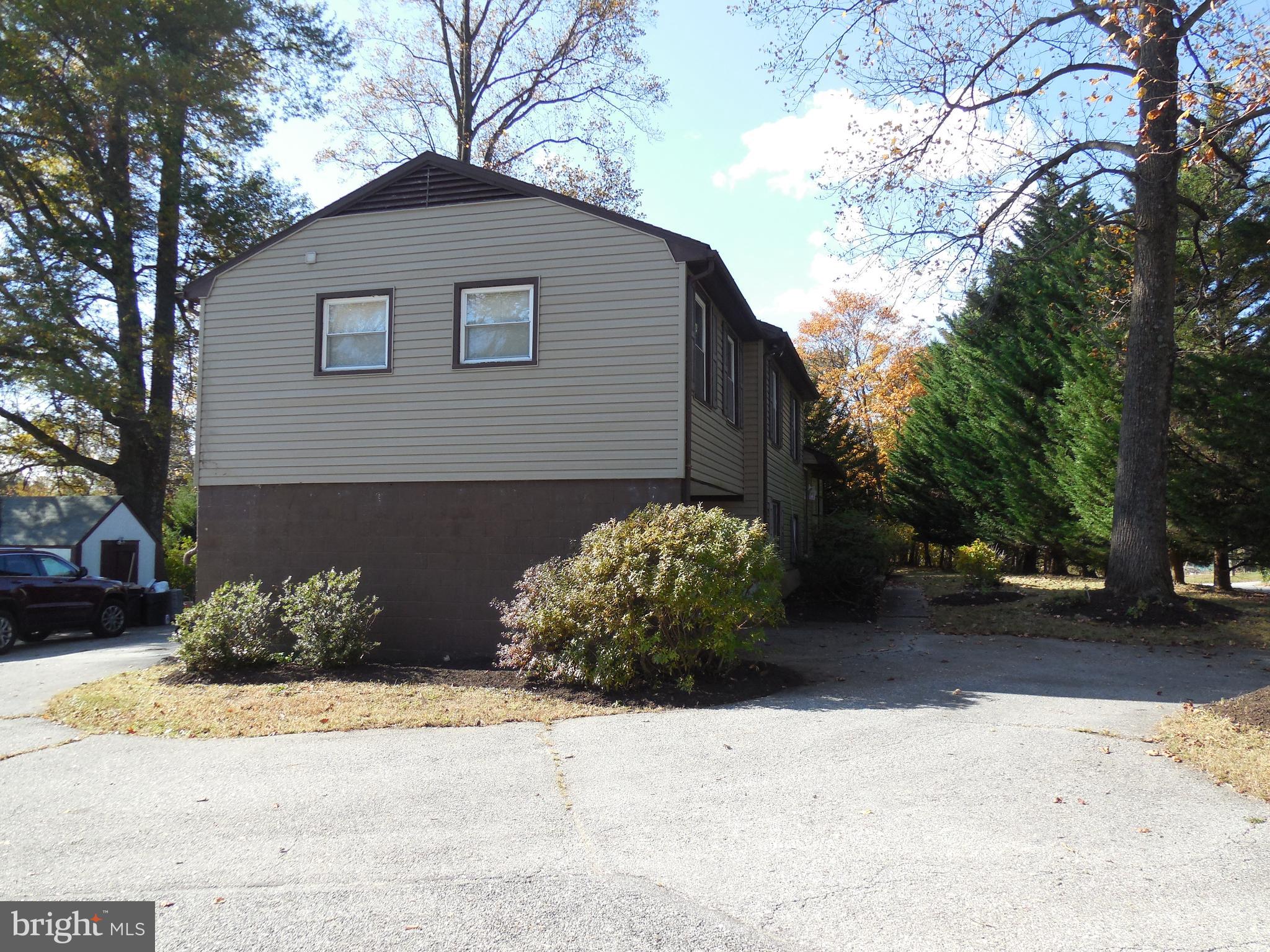 607 Church Road Reisterstown, MD 21136 - Photo 6 of 34 a front view of a house with a yard