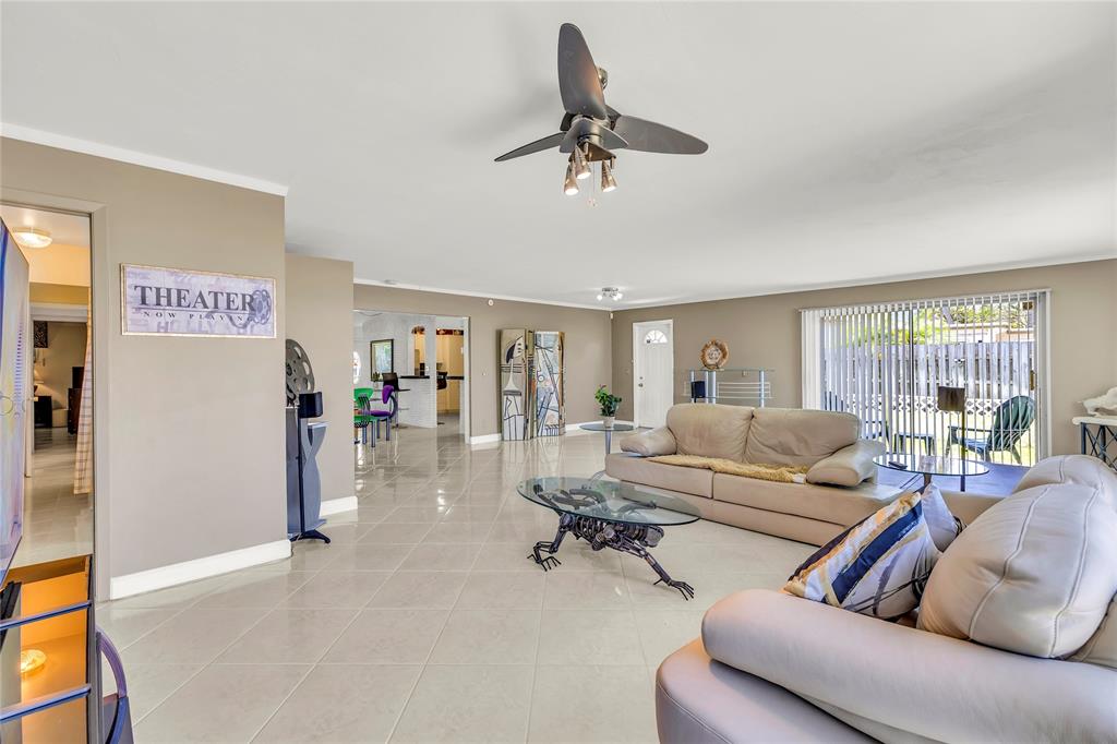 1961 Northeast 31st Street Lighthouse Point, FL 33064 - Photo 24 of 31 a living room with furniture and a window