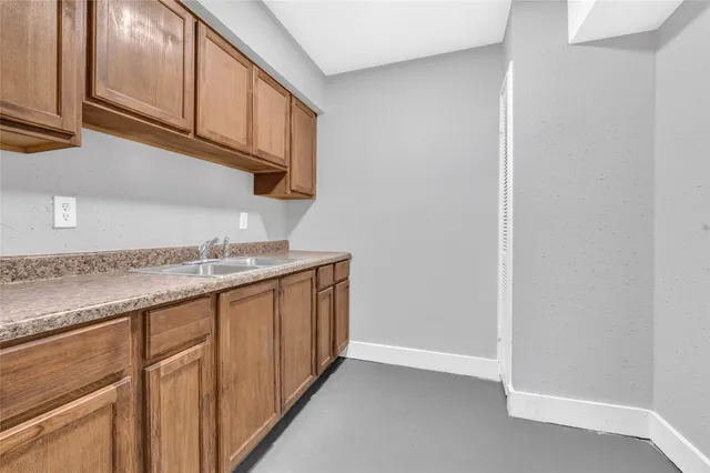 a kitchen with granite countertop cabinets and a sink