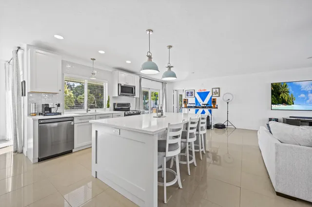 a kitchen with a sink and stove