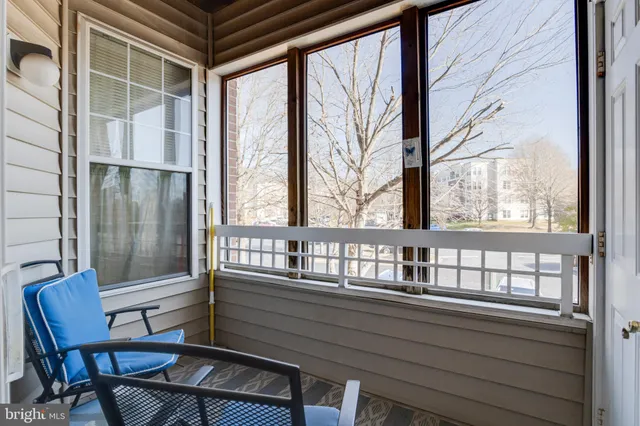 a view of porch with a bench