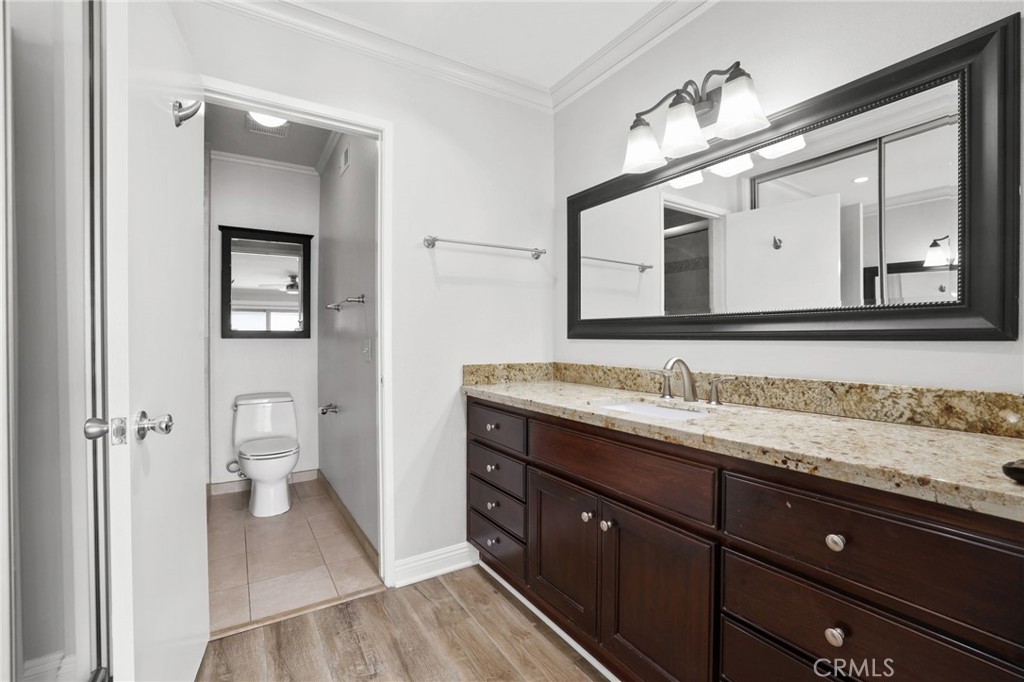 14452 Pimlico Road Westminster, CA 92683 - Photo 24 of 45 a bathroom with a granite countertop sink mirror and toilet