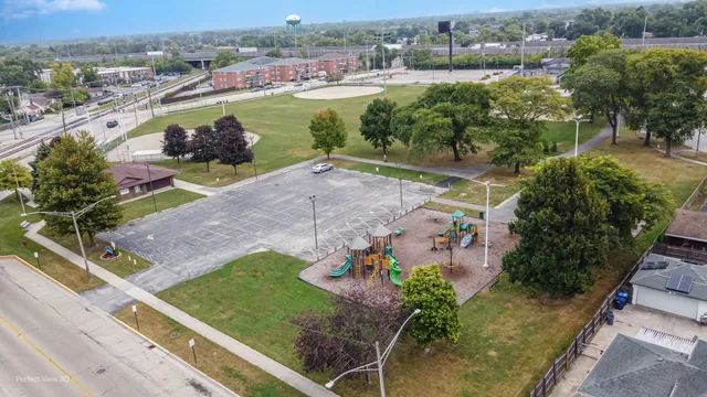 an aerial view of residential houses with outdoor space