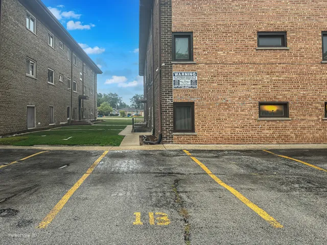 a view of a brick house with a street