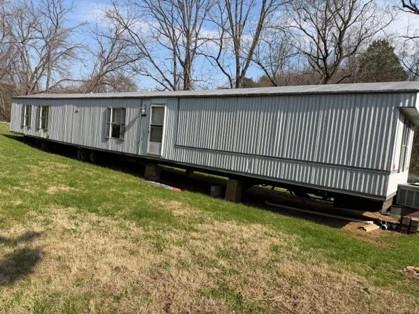 a view of a backyard with a small cabin