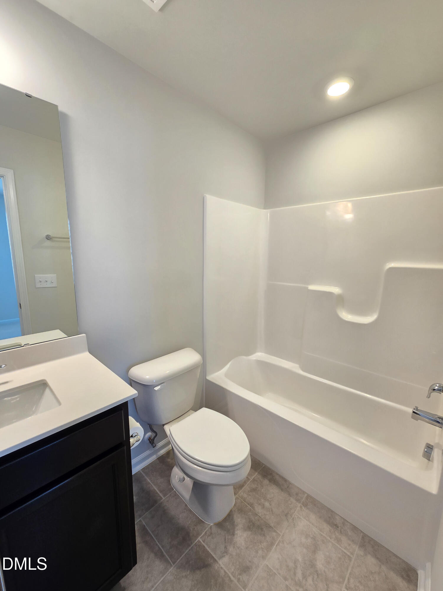 2431 Kasota Lane Raleigh, NC 27610 - Photo 43 of 46 a bathroom with a toilet a sink and bathtub