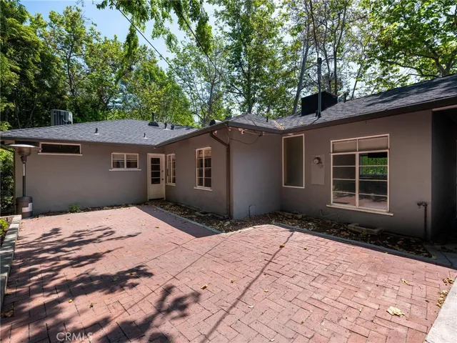 a house with trees in the background