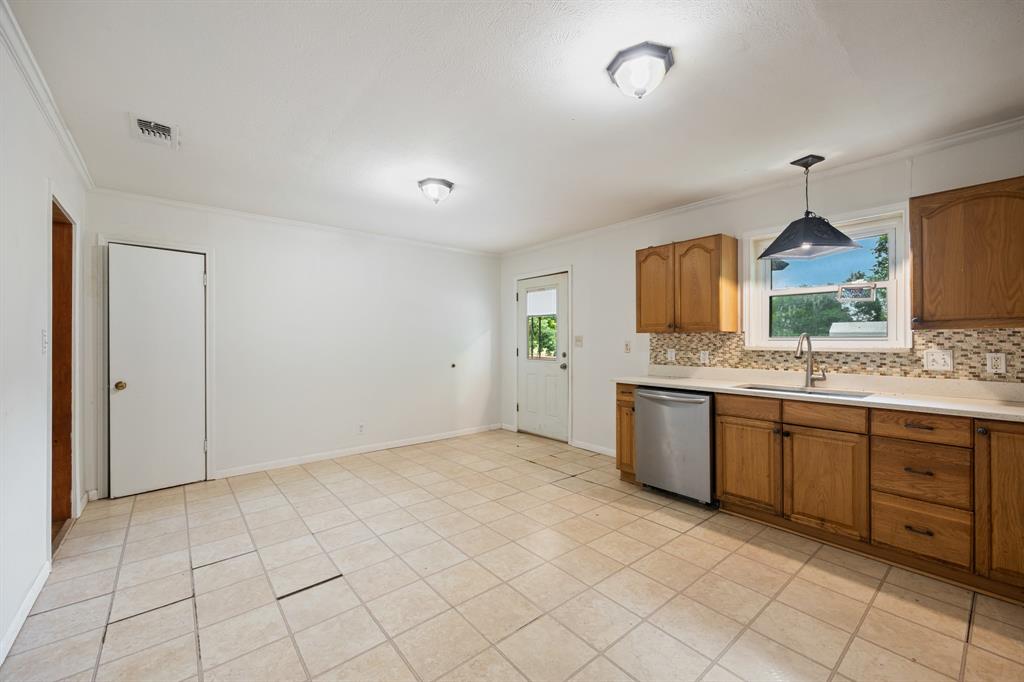 571 South 1st Street Point, TX 75472 - Photo 12 of 27 a spacious bathroom with a granite countertop sink and a mirror
