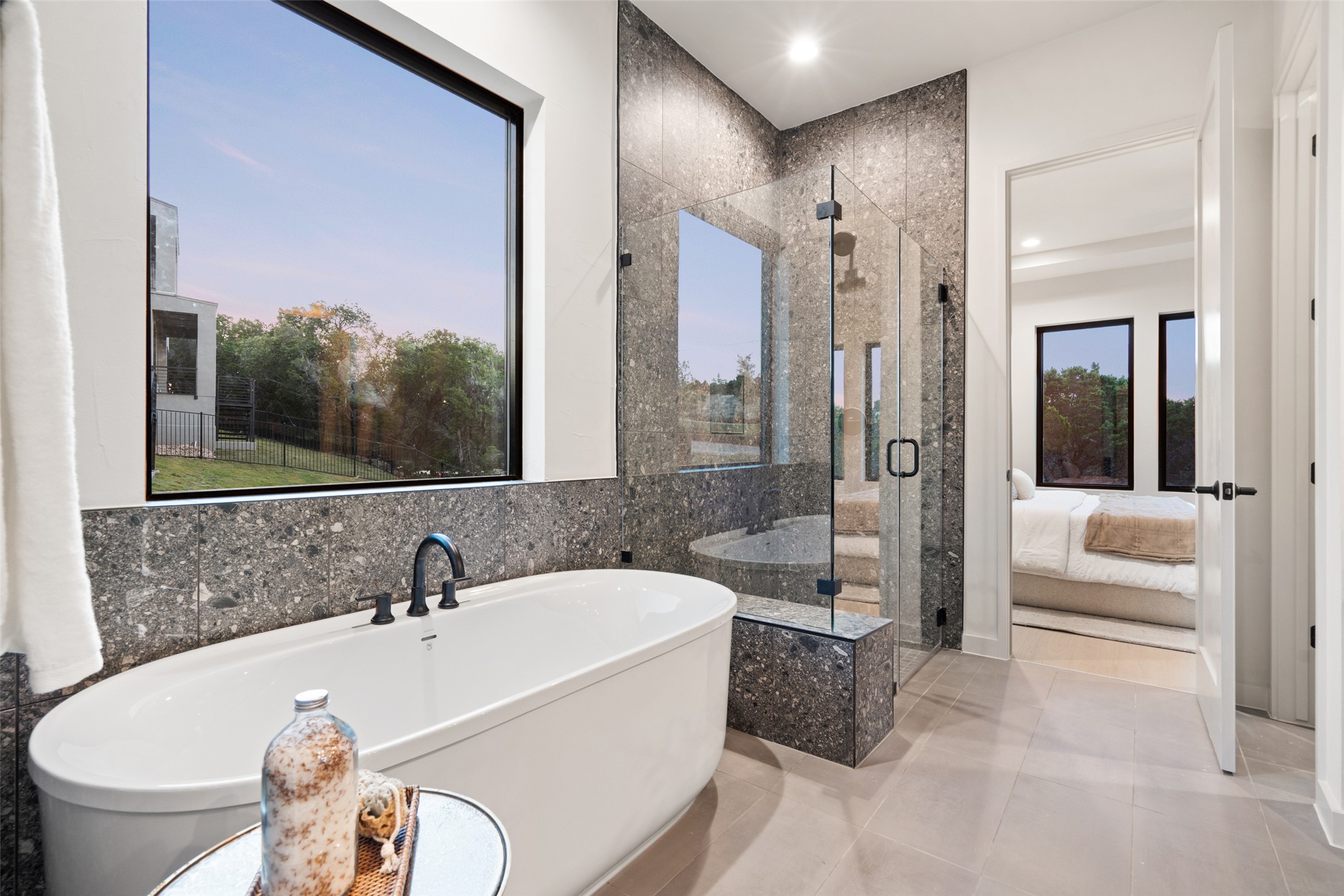 9803 Ribelin Ranch Court, Unit 6 Austin, TX 78750 - Photo 12 of 31 A deep soaking tub and a spacious glass-enclosed shower create a spa-like retreat.