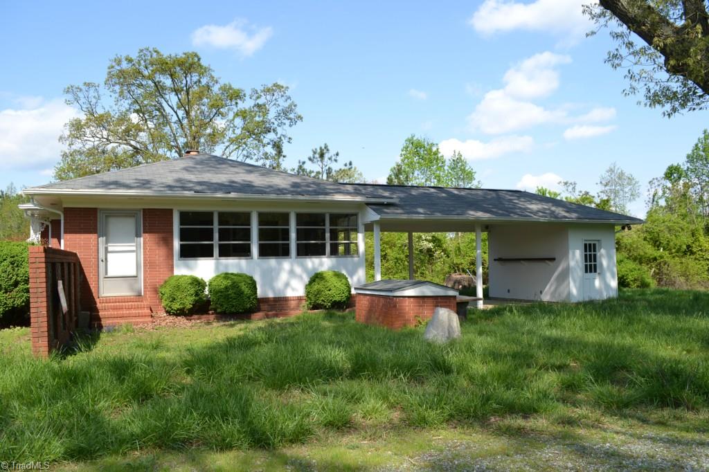1463 Talbot Road Pleasant Garden, NC 27313 - Photo 2 of 13 Right side view of home with 2 car port