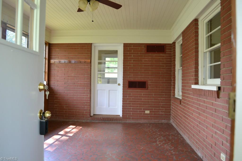 1463 Talbot Road Pleasant Garden, NC 27313 - Photo 6 of 13 Enter into sunroom that leads off the kitchen and dining room