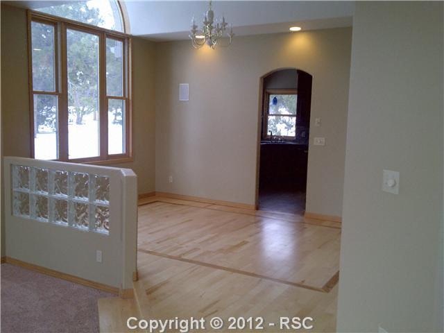 18518 Wetherill Road Monument, CO 80132 - Photo 5 of 16 Beautiful hardwood floors with inlay