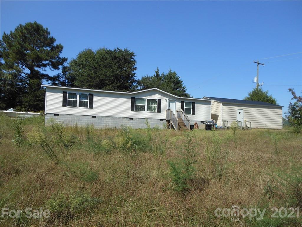 91 Foster Lake Road Blacksburg, SC 29702 - Photo 11 of 31 a house view with a garden space