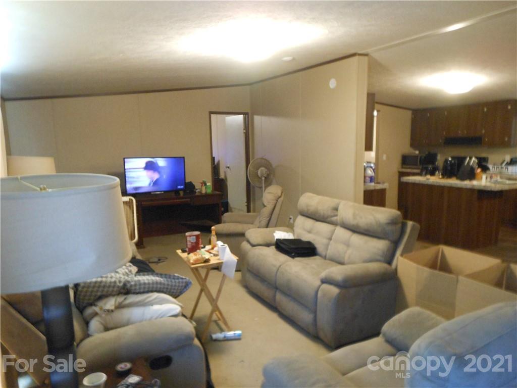 91 Foster Lake Road Blacksburg, SC 29702 - Photo 13 of 31 a living room with furniture a flat screen tv and a fireplace