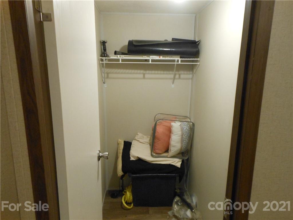 91 Foster Lake Road Blacksburg, SC 29702 - Photo 22 of 31 a view of storage and utility room with washer dryer