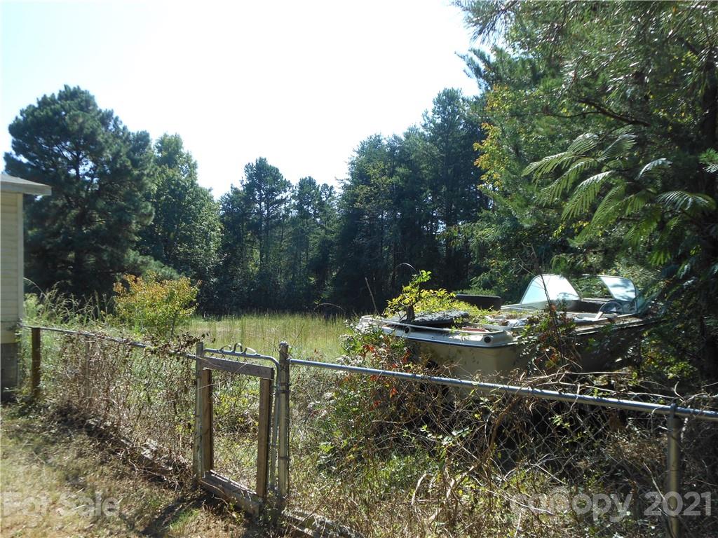 91 Foster Lake Road Blacksburg, SC 29702 - Photo 7 of 31 a view of a yard with large trees