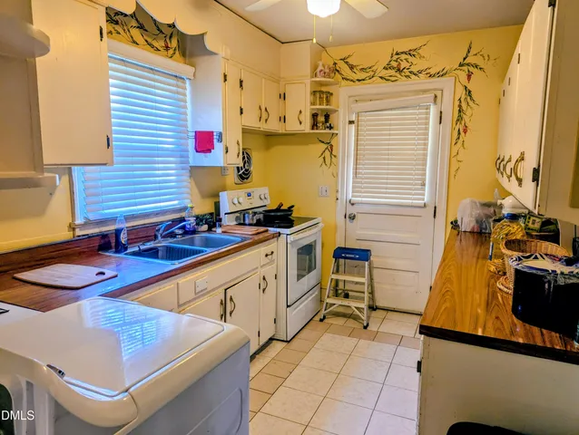 a view of a kitchen with appliances