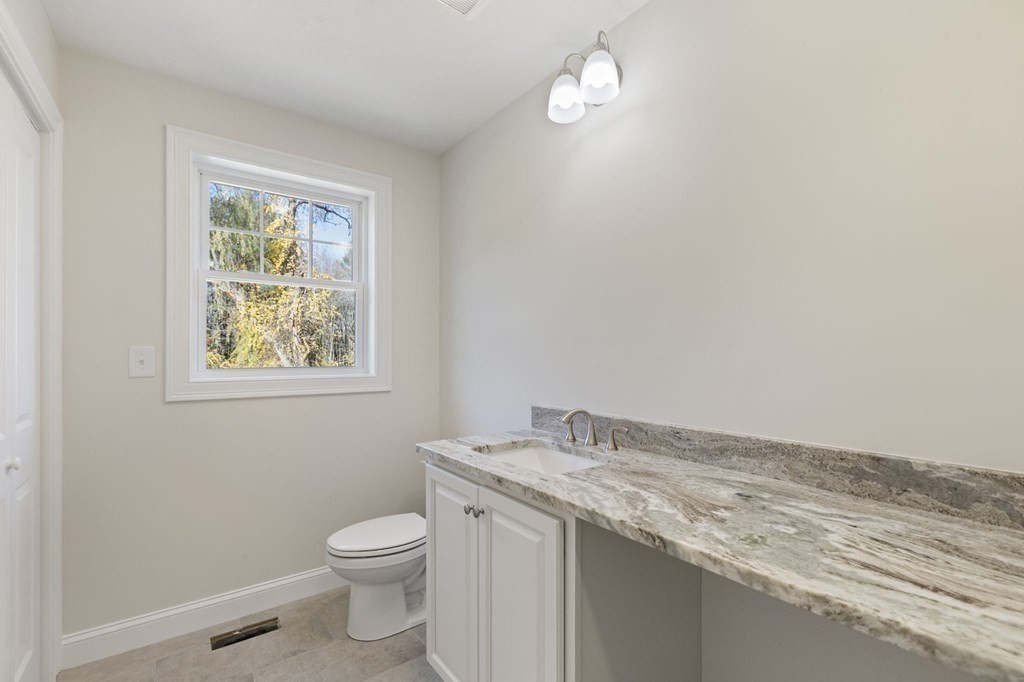 171 Rangeway Road North Billerica, MA 01862 - Photo 11 of 35 a bathroom with a granite countertop toilet and a sink