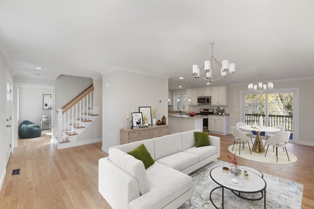171 Rangeway Road North Billerica, MA 01862 - Photo 4 of 35 a living room with furniture a chandelier and a dining table