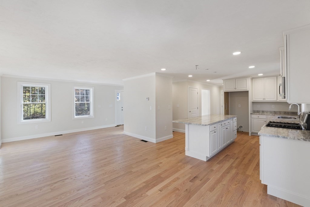171 Rangeway Road North Billerica, MA 01862 - Photo 5 of 35 a view of kitchen with kitchen island wooden floors appliances and cabinets