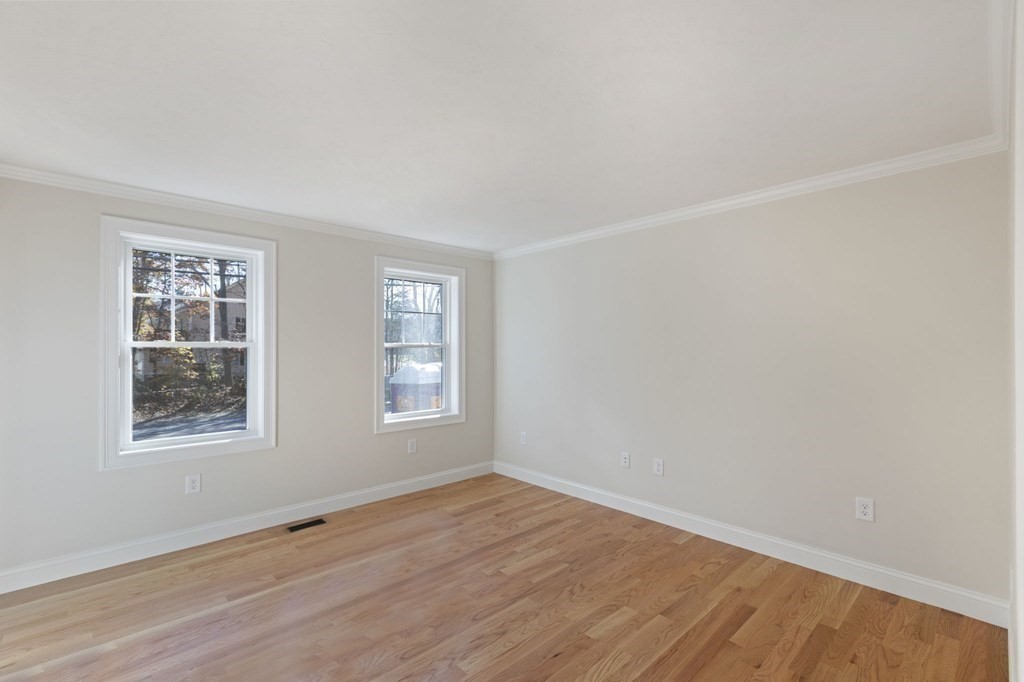 171 Rangeway Road North Billerica, MA 01862 - Photo 9 of 35 an empty room with wooden floor and windows