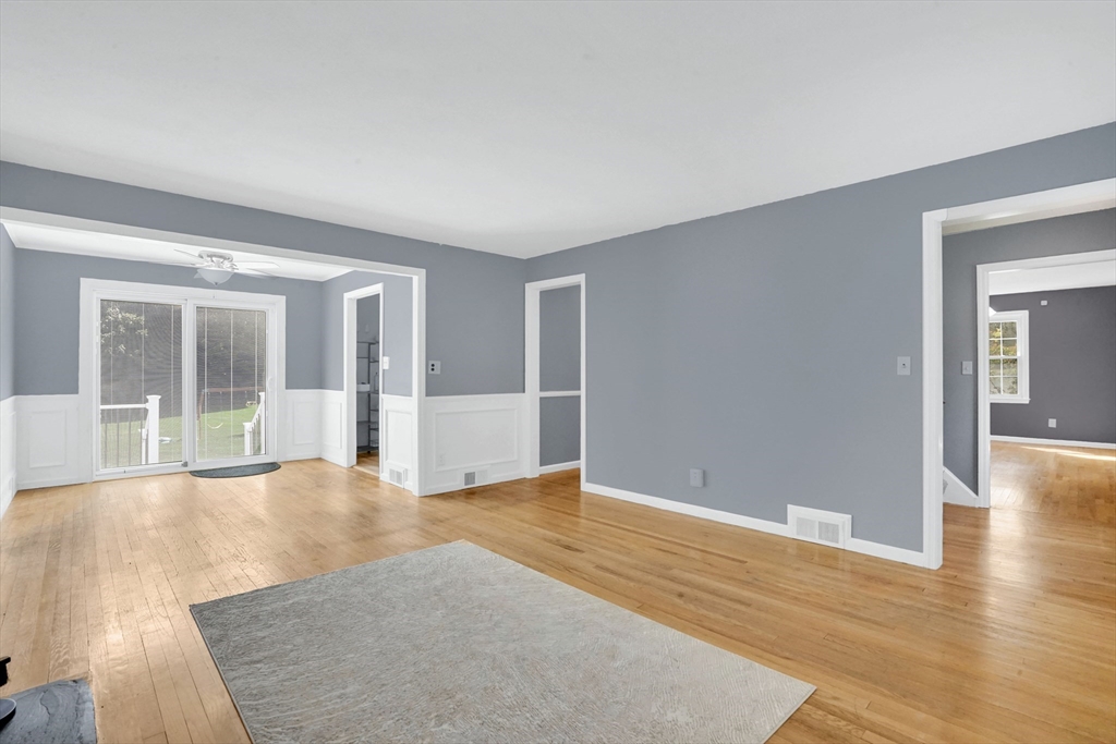 81 Oak Hollow Road Springfield, MA 01128 - Photo 16 of 42 a view of an empty room with wooden floor and a window