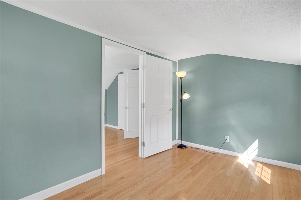81 Oak Hollow Road Springfield, MA 01128 - Photo 30 of 42 a view of an empty room with wooden floor